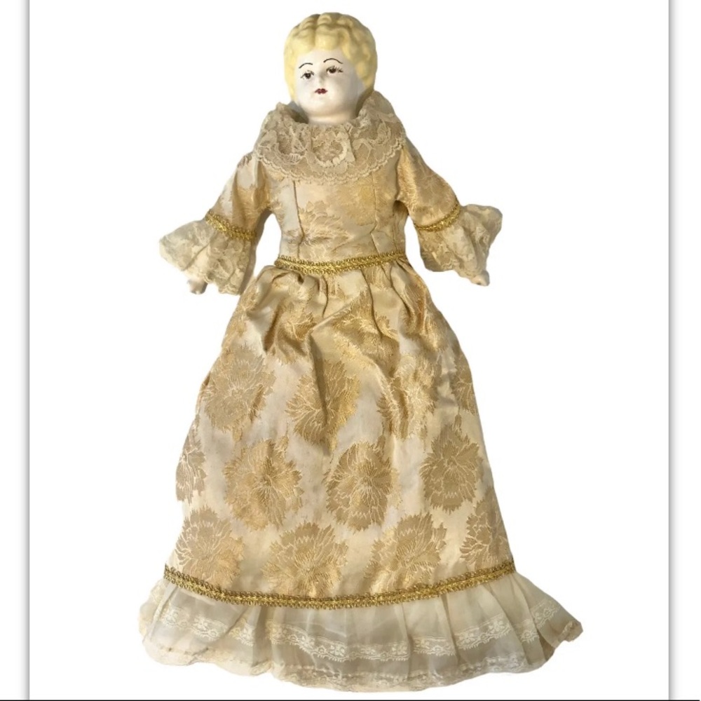 Vintage porcelain 19” doll in ornate gown with petticoats